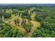 An aerial view of a lush green lot with scattered trees at 20250 Nw 71St Ct, Micanopy, FL 32667
