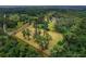 An aerial view of lot lines of the property, surrounded by trees at 20250 Nw 71St Ct, Micanopy, FL 32667