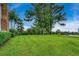 Expansive backyard featuring mature trees and neatly mowed grass at 20250 Nw 71St Ct, Micanopy, FL 32667