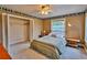 Cozy bedroom with striped bedding and a decorative border at 20250 Nw 71St Ct, Micanopy, FL 32667