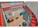 Bright foyer with a curved staircase, red carpet, a classic entrance, and detailed trim at 20250 Nw 71St Ct, Micanopy, FL 32667