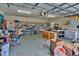 Large garage with storage shelves, work tables, and concrete floor at 20250 Nw 71St Ct, Micanopy, FL 32667