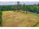 Large vacant lot with trees near the road and perimeter fencing at 20250 Nw 71St Ct, Micanopy, FL 32667