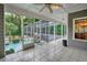 Screened-in patio with access to a pool and hot tub is perfect for relaxation and entertaining at 20250 Nw 71St Ct, Micanopy, FL 32667