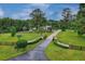 Expansive property with manicured lawns, mature trees, and elegant gated entrance, offering a private retreat at 20250 Nw 71St Ct, Micanopy, FL 32667