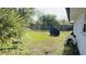 This backyard is surrounded by green grass at 251 Celery Cir, Oviedo, FL 32765