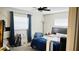 This bedroom features two windows, a fan, and a lamp at 251 Celery Cir, Oviedo, FL 32765