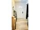 Entryway featuring wood-look flooring, modern light fixture, and white front door at 251 Celery Cir, Oviedo, FL 32765