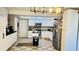 Spacious kitchen with white cabinetry, stainless steel appliances, and modern lighting at 251 Celery Cir, Oviedo, FL 32765