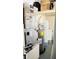 This utility room houses the water heater and the air handler at 251 Celery Cir, Oviedo, FL 32765