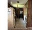 View of a galley style kitchen, with a stove, washer and refrigerator at 15750 Ne 150Th Ter, Fort Mc Coy, FL 32134