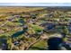 Stunning aerial view of the community golf course, complete with water features, manicured greens, and beautiful landscaping at 17781 Sw 72Nd Street Rd, Dunnellon, FL 34432