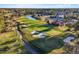 Overhead view of the golf course lined by beautiful homes, green fairways, sand traps, and a tranquil lake at 17781 Sw 72Nd Street Rd, Dunnellon, FL 34432