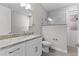 Modern bathroom with double sink vanity and tiled walk-in shower at 17781 Sw 72Nd Street Rd, Dunnellon, FL 34432