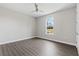 Bright and airy bedroom with modern ceiling fan and large window overlooking the yard at 17781 Sw 72Nd Street Rd, Dunnellon, FL 34432