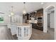 Stunning kitchen featuring a large island with granite countertops and stainless steel appliances at 17781 Sw 72Nd Street Rd, Dunnellon, FL 34432