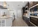 Bright, open kitchen with stainless steel appliances and spacious center island with pendant lights at 17781 Sw 72Nd Street Rd, Dunnellon, FL 34432