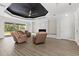 Open-concept living area boasts recessed lighting, a fireplace, neutral walls, and wood floors for a modern look at 17781 Sw 72Nd Street Rd, Dunnellon, FL 34432