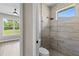 Bathroom view into tiled shower and lavatory at 17887 Sw 72Nd Street Rd, Dunnellon, FL 34432