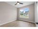Bright bedroom with wood-look flooring and a large window offering a pleasant view at 17887 Sw 72Nd Street Rd, Dunnellon, FL 34432