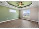 Bright bedroom features high ceilings, a ceiling fan, and large windows at 17887 Sw 72Nd Street Rd, Dunnellon, FL 34432