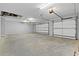 Spacious three-car garage with high ceilings and ample storage space at 17887 Sw 72Nd Street Rd, Dunnellon, FL 34432