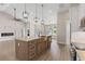 Gourmet kitchen features a central island, stainless steel appliances, and open floor plan at 17887 Sw 72Nd Street Rd, Dunnellon, FL 34432