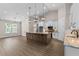 Spacious kitchen boasts an island with pendant lighting and stainless steel appliances at 17887 Sw 72Nd Street Rd, Dunnellon, FL 34432