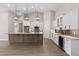 Open kitchen showcases custom cabinets, granite counters, and stainless steel appliances at 17887 Sw 72Nd Street Rd, Dunnellon, FL 34432