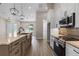 This kitchen showcases custom cabinets, stone countertops and stainless steel appliances at 17887 Sw 72Nd Street Rd, Dunnellon, FL 34432