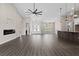 Spacious open floorplan with modern kitchen, living area, and entryway to bathroom at 17887 Sw 72Nd Street Rd, Dunnellon, FL 34432