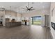 Bright, open living space with modern kitchen, large island, and sliding glass doors at 17887 Sw 72Nd Street Rd, Dunnellon, FL 34432