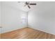 Cozy bedroom featuring wood laminate flooring, ceiling fan, and natural light at 2297 Montbrook Pl, The Villages, FL 32162