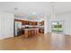 Modern kitchen featuring wooden cabinetry, stainless steel appliances, and tile floors at 2297 Montbrook Pl, The Villages, FL 32162