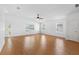 Bright living room featuring tile floors, multiple windows, and a ceiling fan at 2297 Montbrook Pl, The Villages, FL 32162