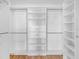 Organized walk-in closet with shelving and rods for ample storage at 2297 Montbrook Pl, The Villages, FL 32162