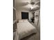 Bedroom with white storage shelves, closets and comfortable bed at 3875 Shaftbury Pl, Oviedo, FL 32765