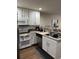 Clean kitchen showcasing white cabinets, stainless steel appliances, and neutral countertops at 3875 Shaftbury Pl, Oviedo, FL 32765