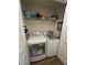 Efficient laundry room with front loading washer and dryer, plus shelving for storage at 3875 Shaftbury Pl, Oviedo, FL 32765