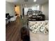 Living space with an open floor plan, connecting the living area to the kitchen and dining space at 3875 Shaftbury Pl, Oviedo, FL 32765