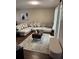 Open living room showcasing a spacious couch, patterned rug, and neutral color scheme at 3875 Shaftbury Pl, Oviedo, FL 32765