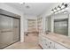 The bathroom showcases a soaking tub, walk-in shower, vanity, and tile floors at 3968 Sw 131St Place Rd, Ocala, FL 34473