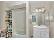 Bright bathroom with tub-shower combo and a white vanity at 3968 Sw 131St Place Rd, Ocala, FL 34473