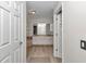 The luxurious bathroom features tile floors, a double sink vanity, and a soaking tub at 3968 Sw 131St Place Rd, Ocala, FL 34473