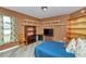 Bedroom with window, shelving, wood chair and bed with teddy bear at 3968 Sw 131St Place Rd, Ocala, FL 34473
