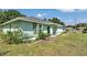 Charming one-story home with green exterior, well-maintained lawn, and lovely curb appeal at 3968 Sw 131St Place Rd, Ocala, FL 34473
