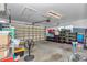 Garage with work space, automatic door opener, overhead lighting, and plenty of storage at 3968 Sw 131St Place Rd, Ocala, FL 34473
