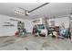 View of garage with door opener, storage and work space at 3968 Sw 131St Place Rd, Ocala, FL 34473