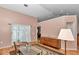 Bright living area with a view into the other living spaces, hardwood floors and comfortable seating at 3968 Sw 131St Place Rd, Ocala, FL 34473