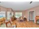Cozy living room with ample natural light, wood floors, and comfortable seating at 3968 Sw 131St Place Rd, Ocala, FL 34473
